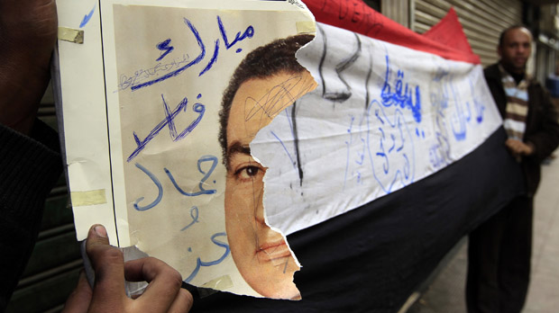 Egypt protests: a torn poster of President Mubarak. (Reuters)