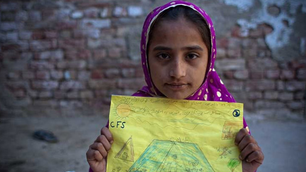 Pakistan floods: Naila Buriro holds up her picture.