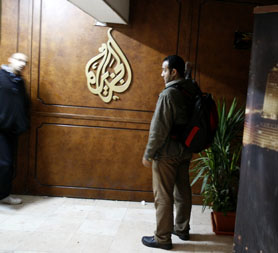 Al-Jazeera employees stand at the pan-Arab television channel's bureau in Cairo on January 30, 2011. Egypt has ordered a shutdown of Al-Jazeera's operations, the official MENA news agency said (Getty)