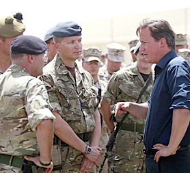 David Cameron meets British and American troops in Afghanistan on 4 July (Image: Getty)
