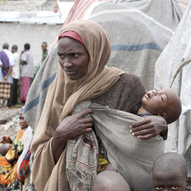 A woman waits with her child for medical treatment at Aden Adde hospital near a displaced persons camp in Waberi (Reuters)