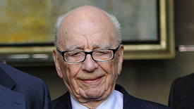 Murdoch prints apology as top US aide quits