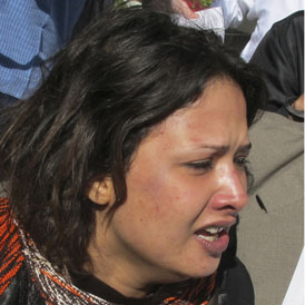 Bruises seen on Eman al-Obeidi's face in March 2011 (Reuters)