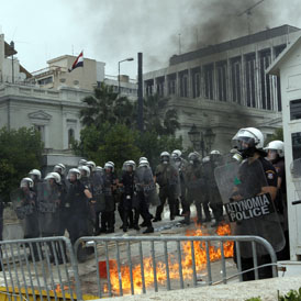 Riot police guard the Greek parliament during clashes at anti-austerity protest in Athens (Reuters)