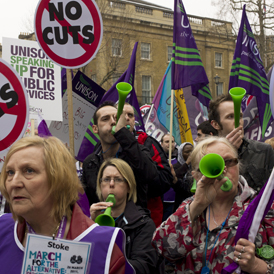 Unison members marching with their banners at the March for the Alternative, organised by the Trades Unions Congress in London (Getty)