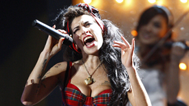 The singer Amy Winehouse has cancelled two dates on her European tour after she was booed for appearing too drunk to perform at a concert in Serbia.
