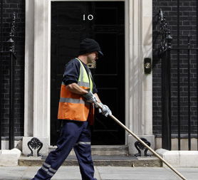 Street cleaner outside 10 Downing Street (Reuters)