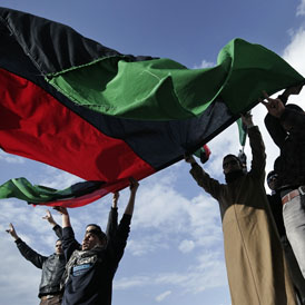 The old Libyan flag on show at an opposition rally in Benghazi (Getty)