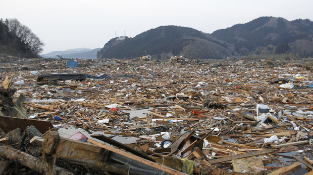 Devastation as workers search the rubble for survivors in Rikuzentakata (Reuters)