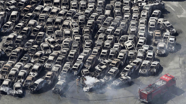 Japan crisis: cars swept away following the earthquake. (Reuters)