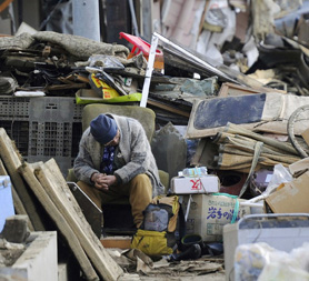 Man in rubble in Kesennuma City, Miyagi Prefecture (R)