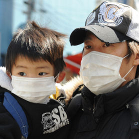 A father and child in protective masks (getty, March 19th)