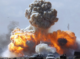Libya air attack: vehicles belonging to pro_Gaddafi forces explode. (Reuters)