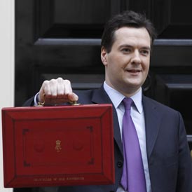 Chancellor George Osborne with his new Budget box in Downing Street (Reuters)