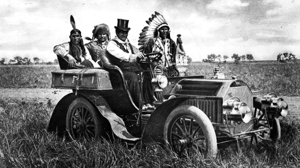 Top-hatted Chiricahua Apache chief Geronimo driving a motor car in Oklahoma (Getty)