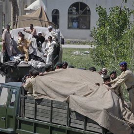 Pakistani soldiers were seen removing the wreckage of the helicopter from the compound in covered trucks after the attack.