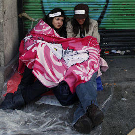 Some 25,000 mostly young people remain camped out in Puerta del Sol for a seventh day of demonstrations against unemployment and austerity measures.