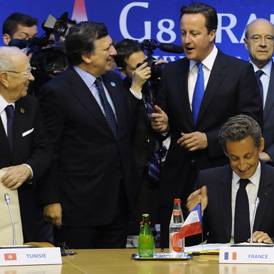 G8 leaders Nicolas Sarkozy and David Cameron relax after the two day summit