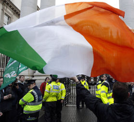 A protestor following clashes with police officers after breaking through the gates of Government Buildings in Dublin, after details of the bailout for Ireland are revealed (credit:Reuters)
