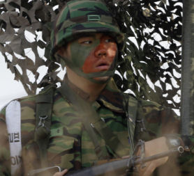A South Korean army soldier attends an exercise before a marines landing drill. China has called from emergency talks between North and South Korea (credit:Reuters)