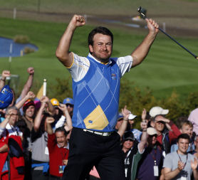 Graeme McDowell celebrates his crucial victory