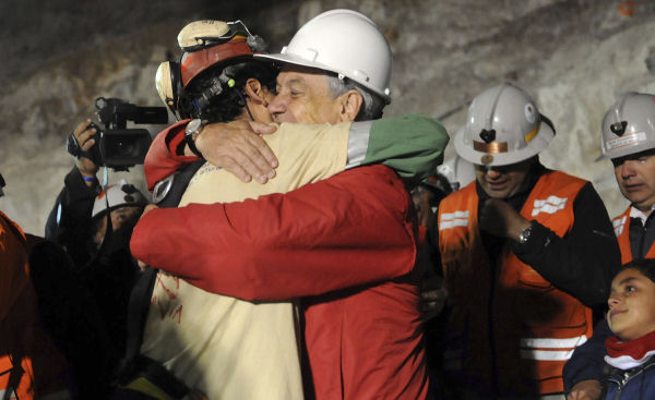 Chilean miners: the first men emerge. (Reuters)