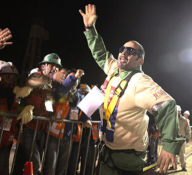 Mario Sepulveda celebrates after becoming the second miner to reach the surface at the San Jose mine in Copiapo
