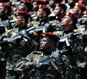 Sri Lankan army commandos march in a military parade during the victory day parade in Colombo on June 18, 2010