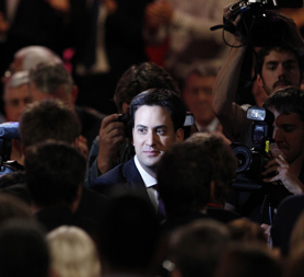 Labour leader Ed Miliband leaves the conference hall after his debut speech. 
