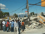 A photo of a damaged building in Haiti. (via Flickr/@troylivesay)