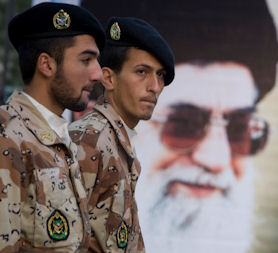 Members of Iran army stand guard in front of picture of Iran&apos;s Supreme Leader Ayatollah Khamenei during ceremony to mark anniversary of Islamic Revolution (credit:Reuters)