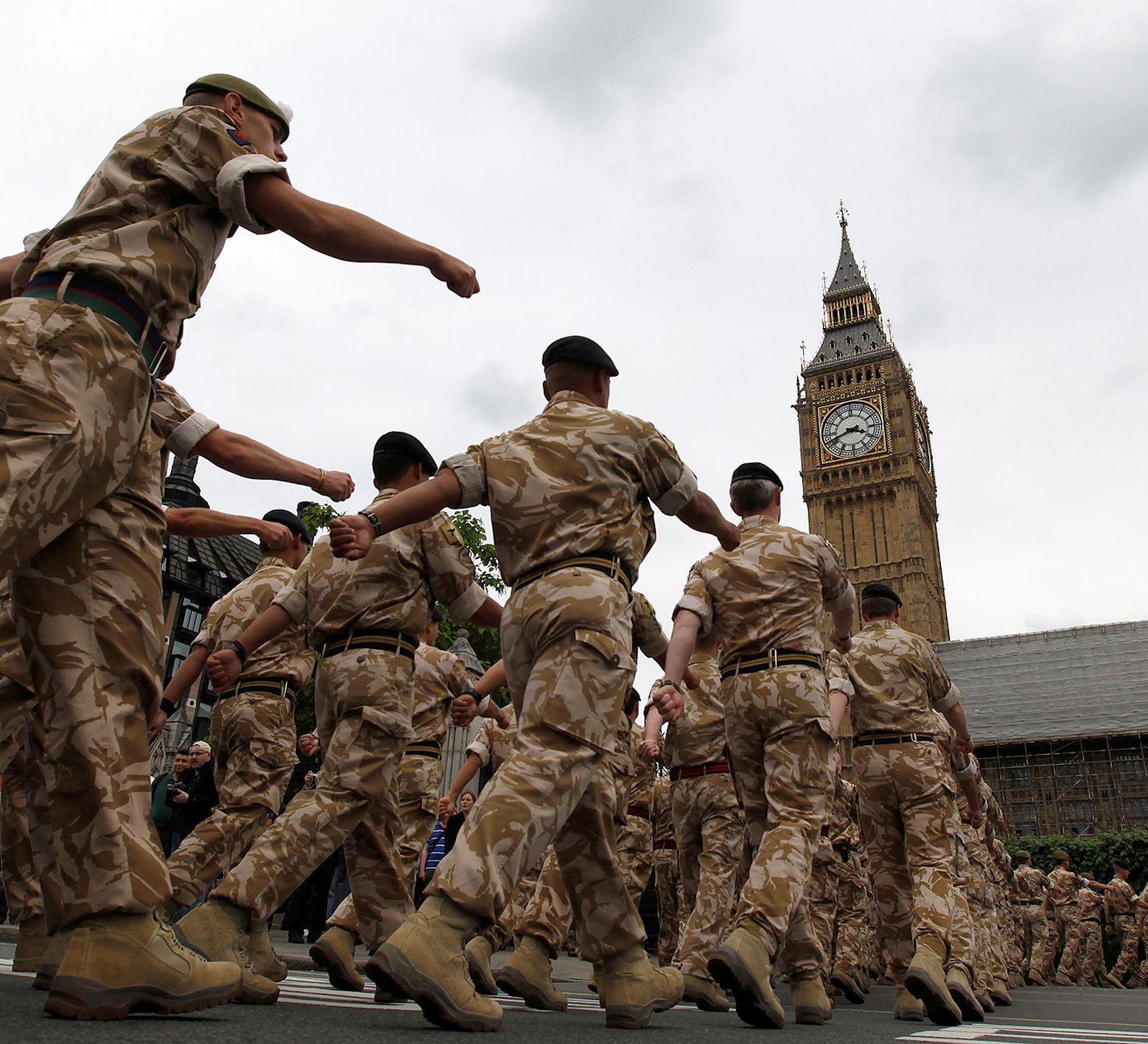 British army soldiers march past parliament