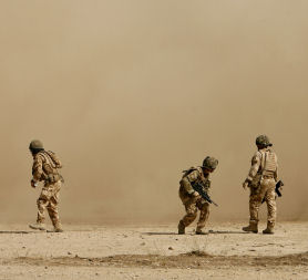 British soldiers take cover 26 July 2009 (Reuters)