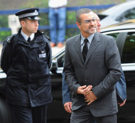 George Michael arrives at Highbury Corner Magistrates Court for sentencing after pleading guilty to possessing cannabis and driving under the influence of drugs at an earlier hearing. (Credit: Getty)