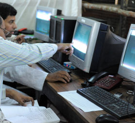 Man helping computer user (credit: Getty Images)