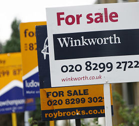 For sale signs (Reuters)