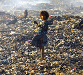 An Indian girl searches through garbage (Getty)