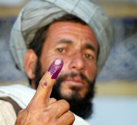 A man with a finger coated in ink (picture: Reuters)