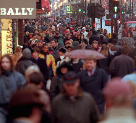 british people in high street - going to be hit hard by todays cuts (Reuters)