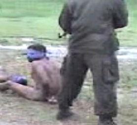 Image from a video apparently showing Sri Lankan soldiers summarily executing Tamils.