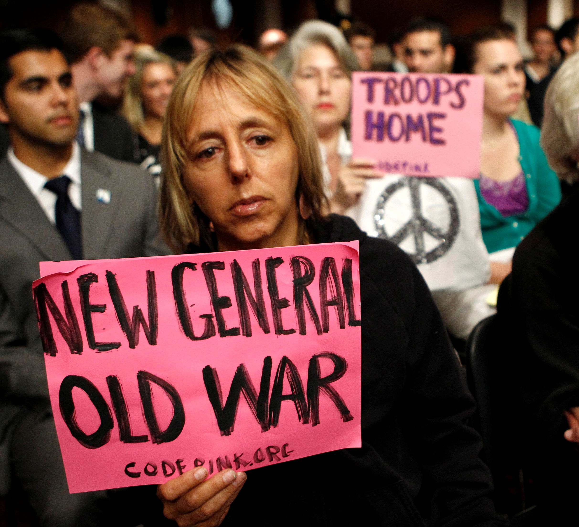 Protesters at Gen. Petraeus&apos; confirmation hearing (Credit: Reuters)