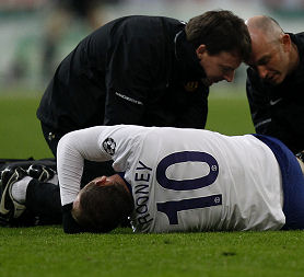 Wayne Rooney after his injury near the end of the Champions League game against Bayern Munich (Reuters)