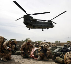 British soldiers take cover as a helicopter lands at Musa Qala in Helmand province, Afghanistan (credit:Reuters)
