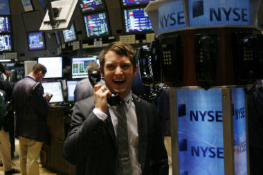 Actor Elijah Wood poses on the floor of the New York Stock Exchange