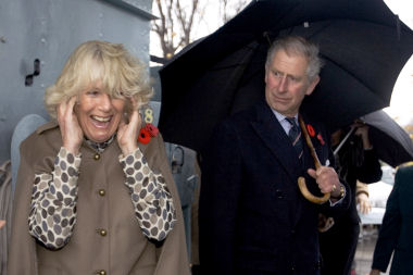 Camilla the Duchess of Cornwall reacts as she waits for her husband Prince Charles to fire the gun on the HMCS Haida in Hamilton.