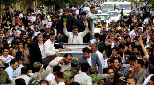 President Ahmadinejad's convoy in crowded street - (Reuters)