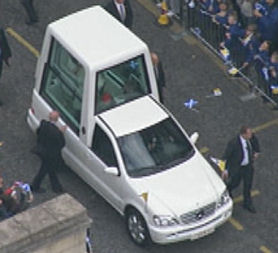 Pope Benedict travels up Princes Street in his Popemobile