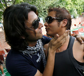 Gay rights activists kiss as they celebrate during a rally in New Delhi (credit:Reuters)