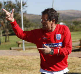 Fabio Capello gestures to members of the media during a training session at the Royal Bafokeng Sports Campus near Rustenburg. (Credit: Reuters)