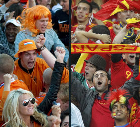 Holland and Spain World Cup fans celebrate (Reuters)